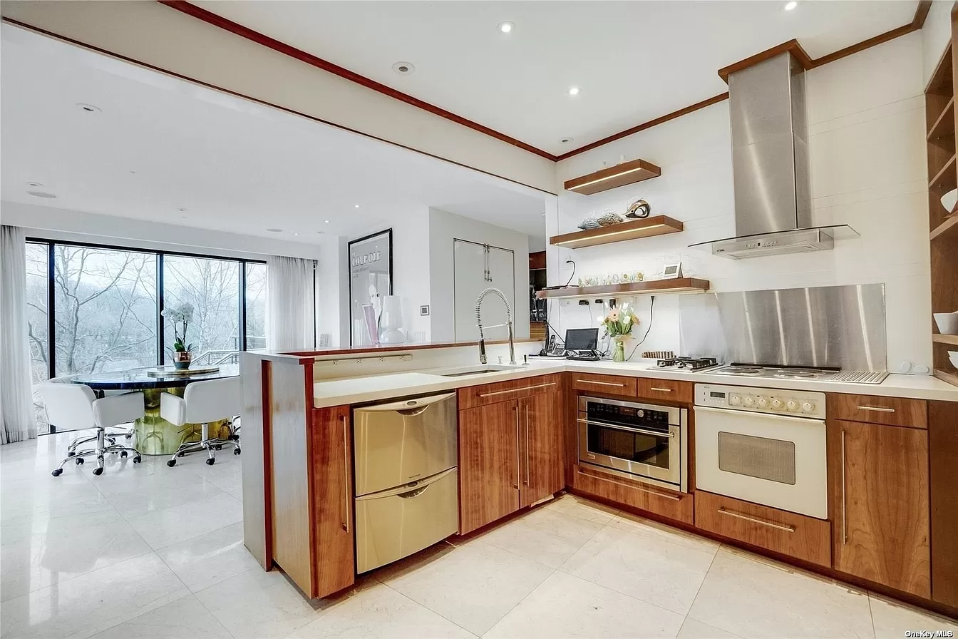 people holding umbrellas on a busy street at night lit by street lights and illuminated signs in Tokyo, Japan